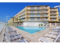 Community pool with plenty of lounge chairs at 201 W Arctic Ave # 421, Folly Beach, SC 29439