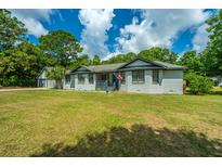 Ranch-style home with gray accents and spacious yard at 3820 Gardenhill Rd, Mount Pleasant, SC 29429