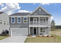 Two-story house with gray siding, a two-car garage, and a front porch at 123 Ashley Cove Way, Summerville, SC 29483