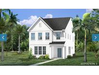 Two-story white farmhouse with a gray door and landscaping at 3104 Sandy Pearl Way, Mount Pleasant, SC 29466