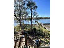 Scenic view of a wooden dock over calm water at 3001 Buccaneer Rd, Isle of Palms, SC 29451