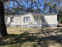 Charming single-story home with front porch and yard at 224 Ruth Anne Dr, Summerville, SC 29483