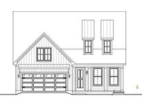 Two story home with a front-facing garage and dormers at 702 Maynard Ln, Summerville, SC 29486
