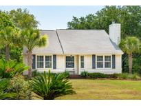 One-story home with white siding, shutters, and palm trees at 1135 Harborgate Dr, Mount Pleasant, SC 29464