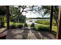 Relaxing patio overlooking peaceful river with chairs and serene view at 3610 Legareville Rd, Johns Island, SC 29455