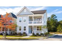 Two-story house with light gray siding, white trim, and a front porch at 130 Cantona Dr, Summerville, SC 29483