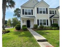 Two story tan house with black shutters and walkway at 9019 Maple Grove Dr, Summerville, SC 29485