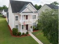 Aerial view of two-story house with landscaping and walkway at 131 Tin Can Aly, Summerville, SC 29483