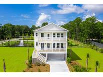 Two story home with detached garage and grassy yard at 1635 Siloh Dr # 483, Mount Pleasant, SC 29466