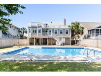 Inviting in-ground pool with spacious backyard at 512 Carolina Blvd, Isle of Palms, SC 29451