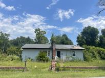 Quaint single story home with mature trees and needs renovations at 306 Ackerman St, Walterboro, SC 29488