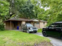 Brick ranch home with carport and mature trees at 1814 S Mayflower Dr, Charleston, SC 29412