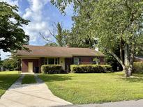 Brick ranch home with a landscaped yard and driveway at 2926 Bolton Rd, Charleston, SC 29414