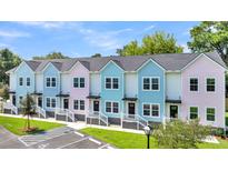 Row of pastel-colored townhouses with parking at 2312 Meridian Rd, North Charleston, SC 29405