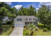 Two-story house with beige siding, and a large front yard at 802 Long Drive Rd, Summerville, SC 29485