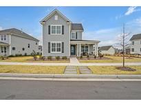 Charming two-story house with gray siding and black shutters at 450 Ripple Park Dr, Summerville, SC 29486