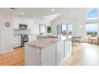 Modern kitchen with granite island and ocean views at 1394/96 Pelican Watch Villas, Seabrook Island, SC 29455