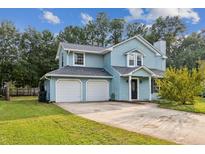 Beautiful two-story home with double garage and landscaped yard at 215 Cantilever Ct, Summerville, SC 29486