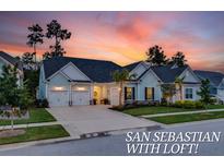 Stunning two-story home with charming curb appeal and a three-car garage at 377 Tupelo Lake Dr, Summerville, SC 29486