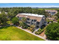 Multi-unit building with lush landscaping and nearby water views at 1637 Live Oak Park, Seabrook Island, SC 29455