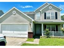 Two-story house with attached garage and landscaping at 506 Holiday Dr, Summerville, SC 29483