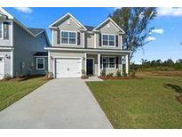 Two-story house with gray siding and a white garage door at 426 Grove End Rd, Moncks Corner, SC 29461