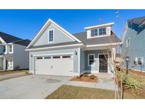 Charming craftsman style home with two-car garage and nicely landscaped yard at 425 Grove End Rd, Moncks Corner, SC 29461