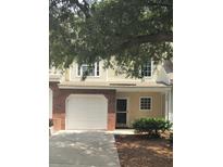 Brick front of townhome with attached garage at 258 Kelsey Blvd, Wando, SC 29492