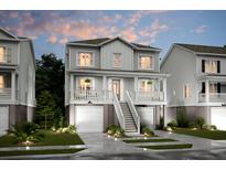 Two-story home with a charming front porch and attached garage at 1668 Siloh Dr # 470, Mount Pleasant, SC 29466
