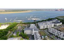 Aerial view of waterfront community with boat slips and nearby buildings at 301 Longshore St # 423, Charleston, SC 29492