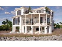 Luxury waterfront home with expansive balconies and pool at 3209 Marshall Blvd, Sullivans Island, SC 29482