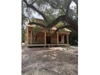 New house under construction with a large tree in the front yard at 108 S Williams Dr, Moncks Corner, SC 29461