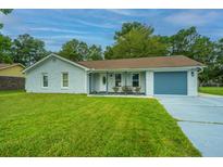 Charming ranch home with a freshly painted exterior and new garage door at 133 Marion Rd, Summerville, SC 29486