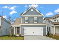 Two-story gray house with white garage door at 423 Grove End Rd, Moncks Corner, SC 29461