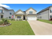 Two-story home with a landscaped yard and driveway at 516 Yellow Leaf Ln, Summerville, SC 29486
