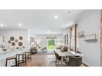 Modern kitchen with white cabinets, granite countertops, and stainless steel appliances at 5528 Bowmore Blvd, Ravenel, SC 29470