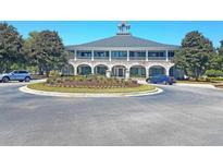 Elegant clubhouse with circular driveway and landscaping at 3427 Colonel Vanderhorst Cir, Mount Pleasant, SC 29466