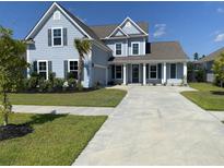 Two-story home with gray siding, white trim, and a large front porch at 174 Whaler Ave, Summerville, SC 29486