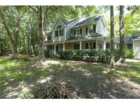 Two story home with large front porch and mature trees at 200 Old Postern Rd, Summerville, SC 29483