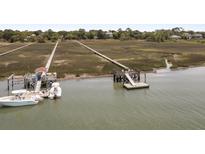 Waterfront property with private dock and boat slips at 218 E Huron Ave, Folly Beach, SC 29439