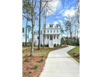 Two-story home with white exterior and landscaping at 1461 Jeremy Cay Ct # 110, Awendaw, SC 29429