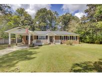 Brick ranch home with carport and spacious yard at 1510 Jahnz Ave, Summerville, SC 29485