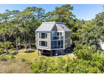 Unique two-story home with metal roof and deck at 2473 High Hammock Rd, Seabrook Island, SC 29455