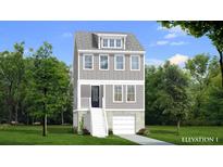 Three-story home with gray siding, white trim, and a two-car garage at 1094 Glenshaw St, North Charleston, SC 29405