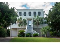 Two story beach home with a large front porch and attached garage at 3002 Palmetto Blvd # 6, Edisto Beach, SC 29438