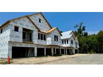 New townhomes under construction with attached garages at 420 Carolina Cherry Ct # 102, Charleston, SC 29414