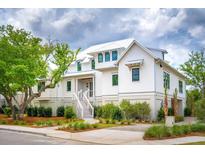 Two story white house with gray roof and landscaping at 1467 Alligator Creek Ct # 104, Awendaw, SC 29429
