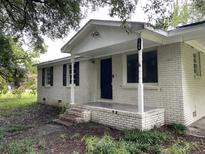 Brick ranch house with covered porch at 155 W End Dr, Moncks Corner, SC 29461