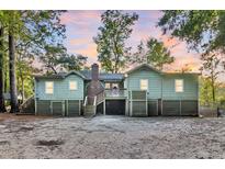 Charming raised cottage with deck, and spacious backyard at 410 Four Holes Road, Dorchester, SC 29437