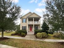 Two story home with red door and landscaped yard at 3699 Shutesbury St, Mount Pleasant, SC 29466